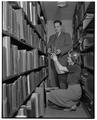 William Kozumplik, Assistant Librarian, and a student shown arranging the new A. D. Taylor landscape architect collection donated to the college, February 1, 1952