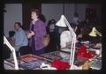 Attendees at coin show in front of Henderson bourse table, 1983