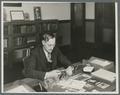 Earl G. Mason at his desk