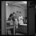 Faculty talking to visitors in lab in Weniger Hall, Fall 1962