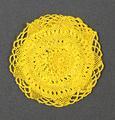 ouch Bag of a circular shape of mustard yellow (turmeric) tatted lace with small floral medallion