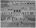 Student class change in front of Commerce Hall (Bexell Hall), November 1960