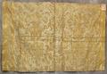 Textile panel of golden beige and tan cotton with metallic silver relief of design