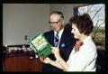 Norman Borlaug and Esther Dickey with her book, "Passport to Survival," Corvallis, Oregon, circa 1971