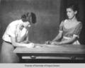 Drama students, Berea College: two young women working at a table