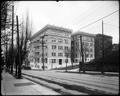 Stelwyn Apartments at Yamhill and St. Clair, Portland. Street and tree in foreground.