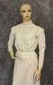 Shirtwaist of white cotton with open-work and embroidery