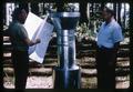 George McNew and colleague with bark beetle trap, 1963