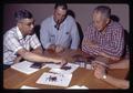 Horace Cheney, Stoney Jackson, and T.J. Starker looking at bark pellets, circa 1965