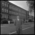 Gary Ford, a member of OSU's G.E. College Bowl team, posing outside of the Commerce Building