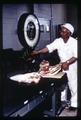 Ralph Turner weighing steaks in Meat Lab, Oregon State University, Corvallis, Oregon, circa 1965