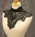 Collar of black crocheted lace in an ornamental lattice design with scalloped edge