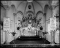 Altar at St. Mary's Academy Chapel, Portland. Flowers surrounding altar.