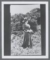 Edith (Coote) Pernot standing outside of Nye Beach summer house, circa 1917