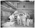 Faculty looking at lab equipment, circa 1956