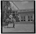 E. L. "Dad" Potter, Animal Husbandry professor, posing with a horse, May 1964