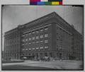 Weinhard Building, with Wadhams & Co. Grocer and Goodyear Rubber Co., at 4th and Oak, Portland. Men standing on corner, horse-drawn wagon at base of building. (recto)