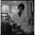 Student working with laboratory equipment in a Home Economics research lab, February 1964