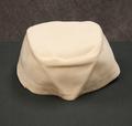 Detachable hat cover of white rayon with buttonholes along the bottom