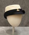 Sailor-style hat of a poly-cotton canvas pillbox crown with brim of stitched navy wool