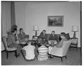 Students and a staff member [?] in a Snell Hall common space