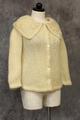 Cardigan of ivory knit in a blend of mohair, wool, and nylon