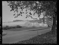 Campus greenhouses with Cordley Hall in the background, Spring 1963