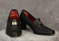 Shoes of textured soft black kid leather with red interior and red at bottom