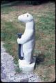 Polar bear with fish, 33 inches tall