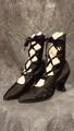Boots of black silk satin with 4 scalloped eyelets