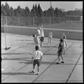 Students playing volleyball on the rooft of Snell Hall