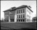 Garfield School, Salem, OR, with lawn in front of building. Houses in background.