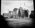 Rear of old Post Office building, 6th and Yamhill, Portland. Horse-drawn mail wagon at loading dock.