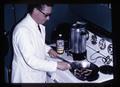 Seafoods Laboratory director Dr. David Crawford cooking fish sausage, circa 1966