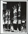 Cheerleaders performing in Gill Coliseum