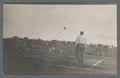 Airborne football during game, circa 1910
