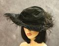 Hat of black velour with black ostrich feathers