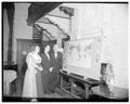 Mollie Strand, August Strand and Chancellor John Richards and Mrs. Richards examining a map of OSC faculty who have conducted research abroad