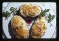 Closeup of twice baked potatoes on plate, 1975