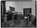 Members of the choir at the Evangelical church enjoy their singing under the direction of Anetta Stroda, December 1950