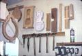 Wall of shop showing jigs and templates