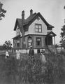 People standing in front of Wilson home