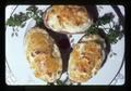 Closeup of twice baked potatoes on plate, 1975