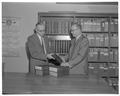 Albert Arust of Portland presents 43 volumes of The Lumberman to Forestry Dean Walter McCulloch, Fall 1961