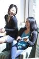 Two students sitting on chair in Global Scholars Hall