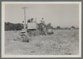 Harvesting machinery in hay field