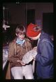 Posing with a beaded art class mask, Camp Arago, Oregon, July 1969