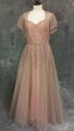 Wedding dress of antique pink fine net over pink taffeta