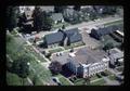 Aerial view of gathering at Corvallis Art Center and adjacent funeral home, Corvallis, Oregon, 1976