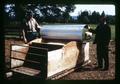 Bob Hiatt and Murray Dawson observe creep feeder, near Scholls, Oregon, circa 1970